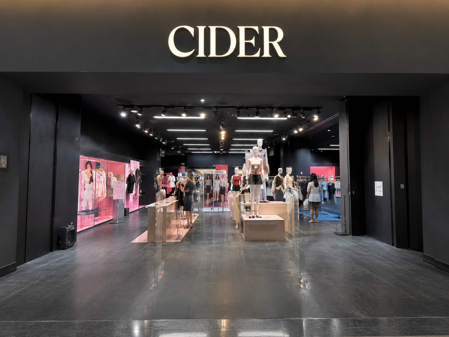 CIDER black department store storefront with mannequins